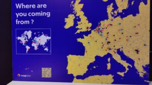 The photo shows a map of Europe. The SotM_EU participants have marked their origin on the map with a pin.